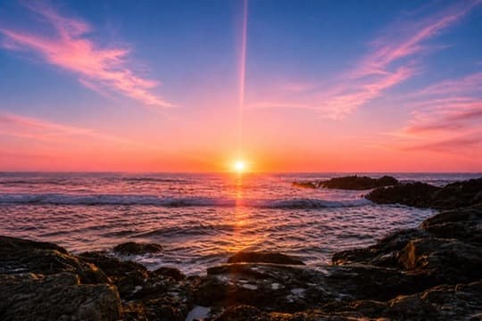 Sunset over ocean with warm golden light